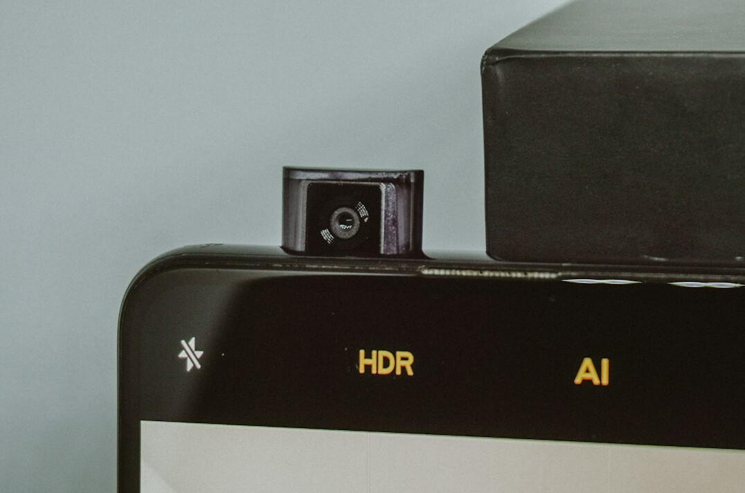 Professional broadcast camera on a pedestal in a modern television studio