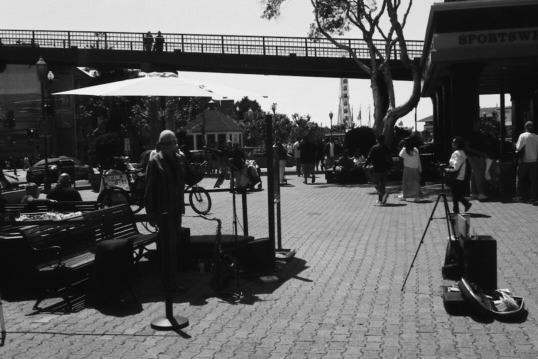 Broadcast crew setting up cables and cameras for a live outside broadcast