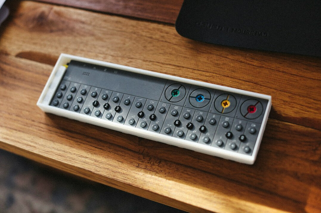 Hands operating a vision mixer switcher desk in a television control room