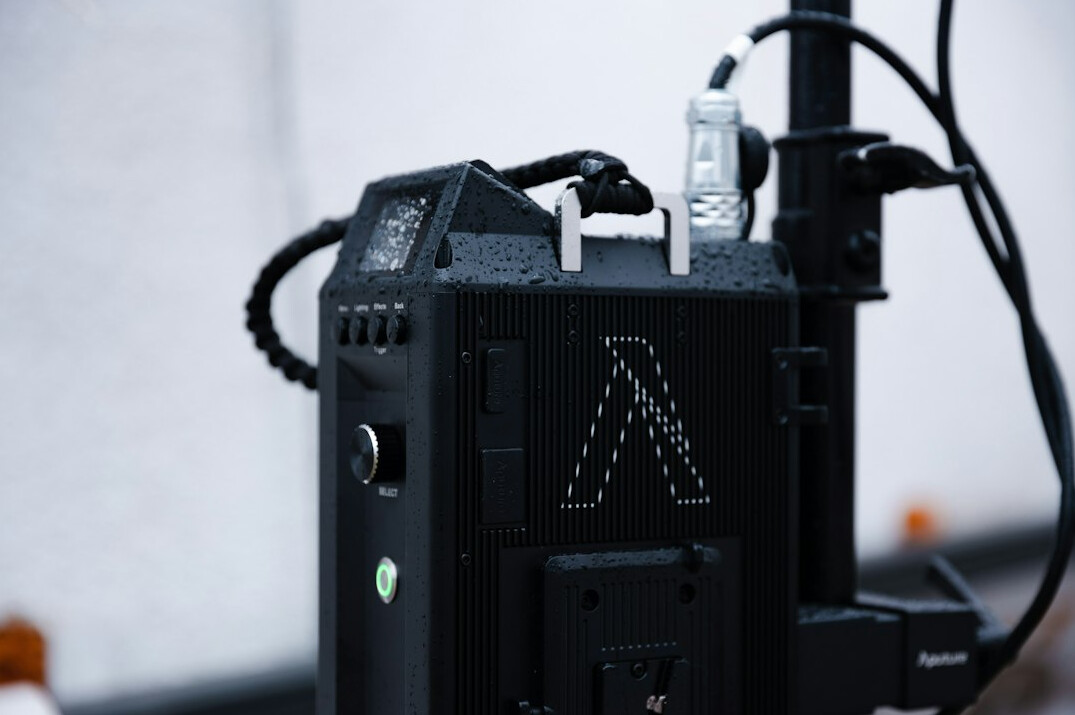 Portable bonded cellular video transmitter attached to a camera